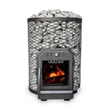 A CozyHeat O floor mount wood-burning sauna stove with sauna stones on top and a visible fire inside the stove.