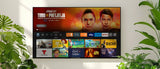 Smart MirageVision Outdoor TV displaying a streaming platform interface with various channels on a white wall background.