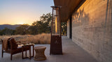 Lava Heat Italia 2G Flame Tower patio heater in an outdoor setting
