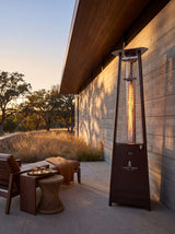 Lava Heat Italia 2G Flame Tower patio heater in an outdoor setting