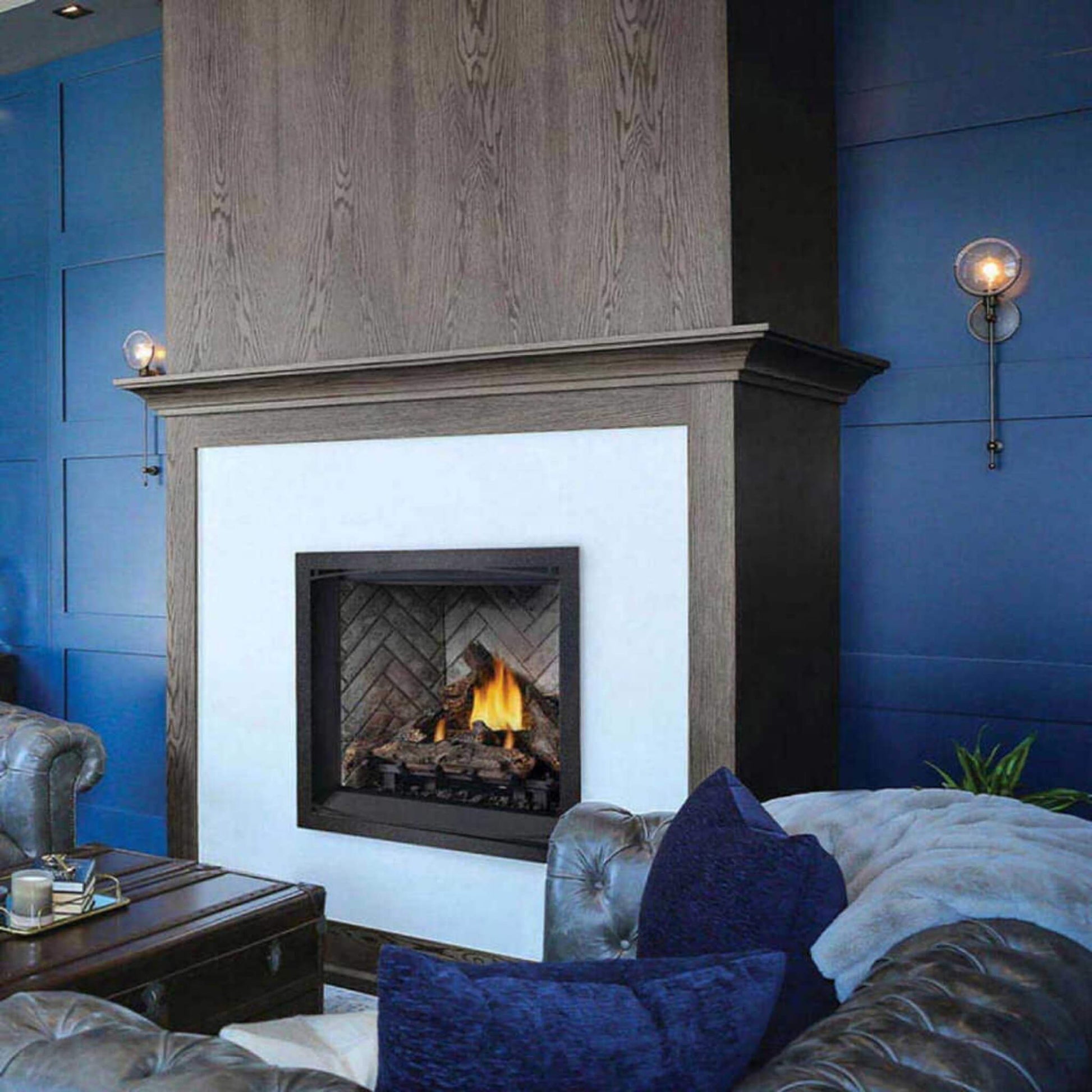 Cozy living room with a fireplace against a blue paneled wall.