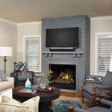 Living room with gray brick fireplace, TV, and furniture.