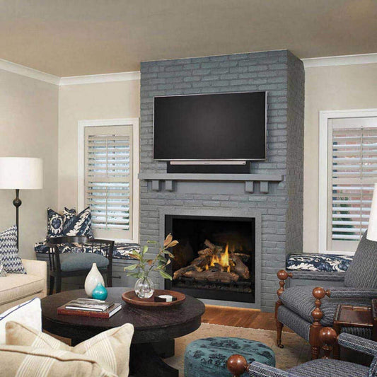 Living room with gray brick fireplace, TV, and furniture.