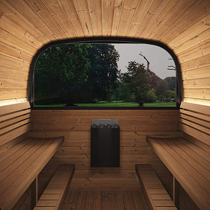 Wooden sauna interior with benches and a window overlooking trees