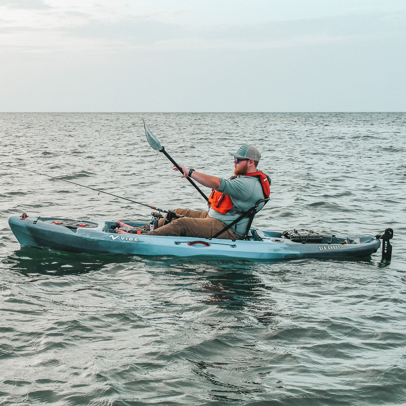 Vibe Sea Ghost 110 Fishing Kayak gliding on calm river waters