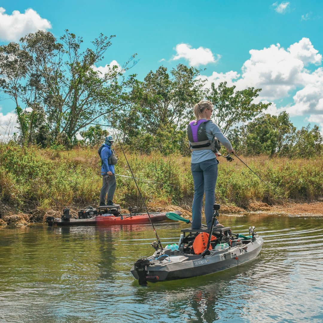 Angler fishing from Vibe Shearwater 125 kayak equipped with rod holders

