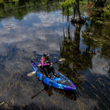 Angler using Vibe Yellowfin 120 kayak equipped with fishing gear